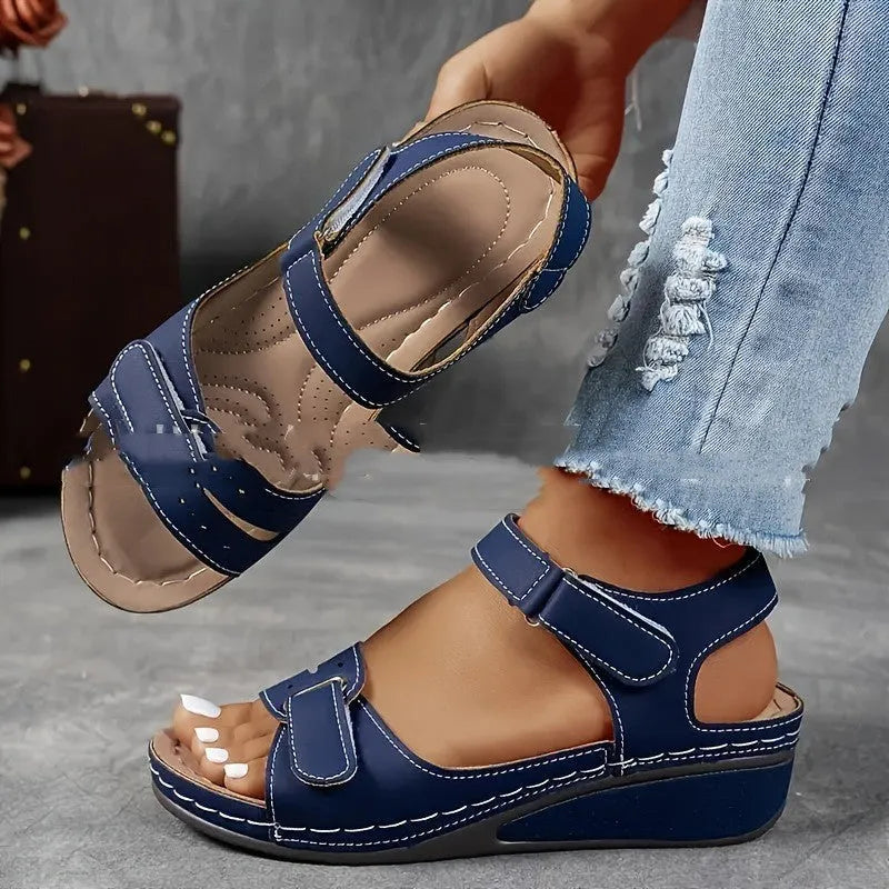 Women's beige strap sandals with a thick composite sole and adjustable Velcro fastening.