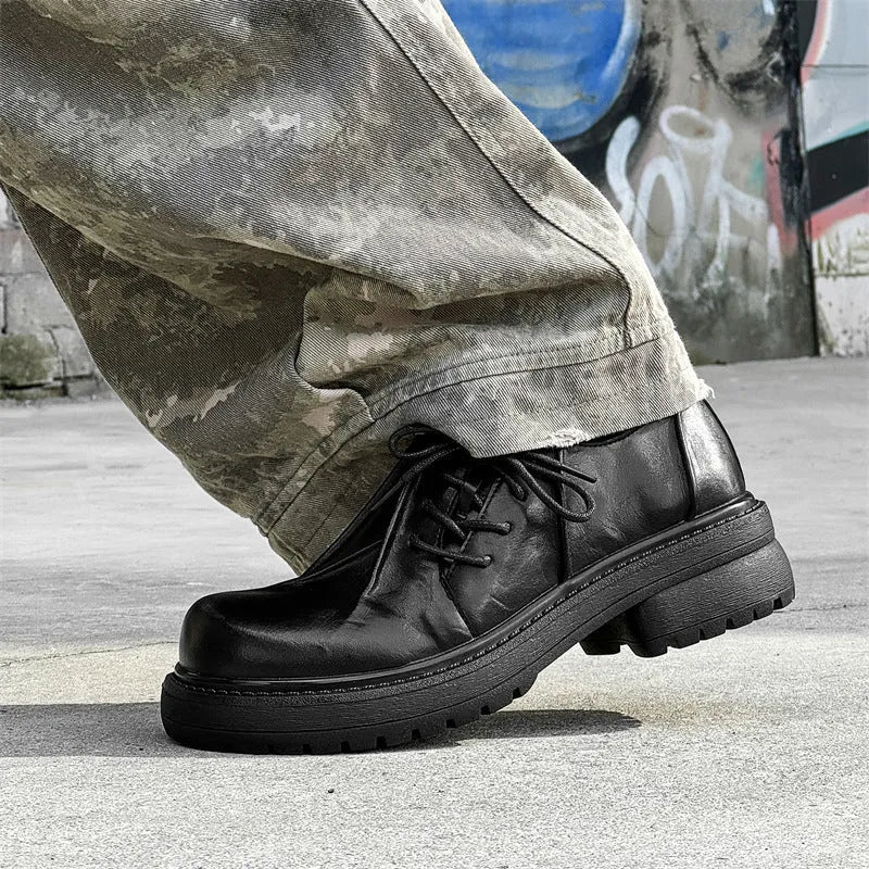 Black platform leather shoes with warped head design and round toe cap