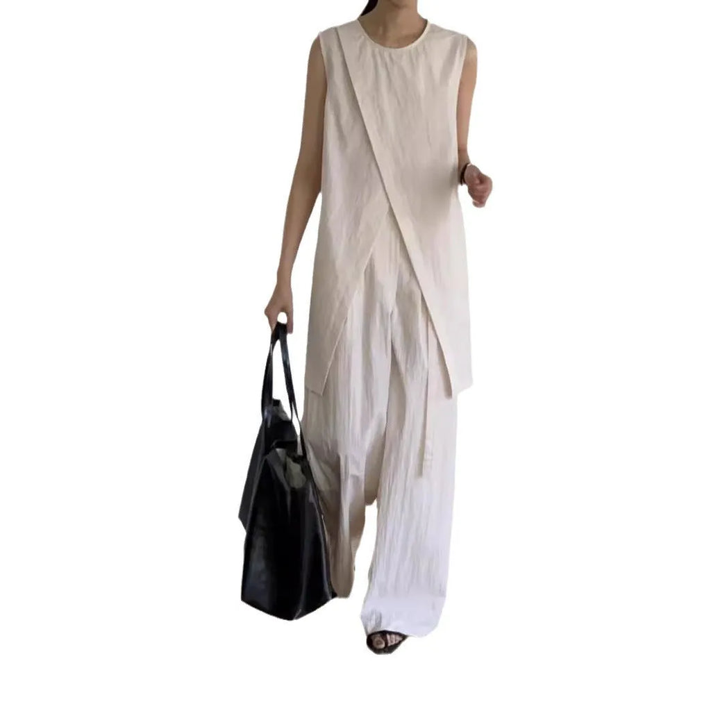 Split sleeveless lace-up top and high waist wide leg pants two-piece set in light apricot or black, average size