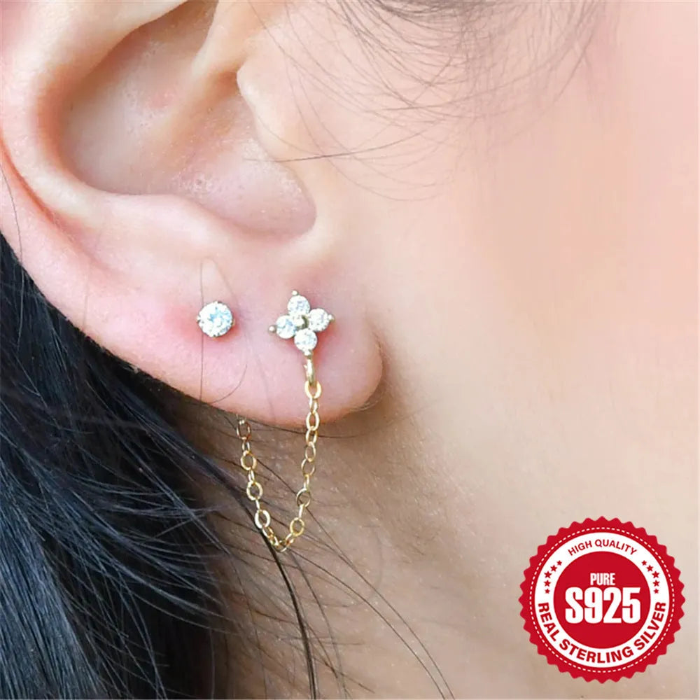 S925 sterling silver ear clip stud earrings with geometric flower design and golden electroplated tassel chain.