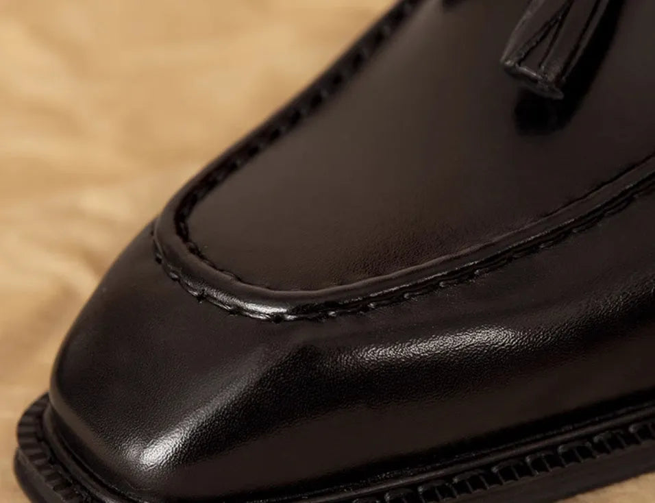 Men's genuine leather slip-on loafers with fringed detailing in black or brown