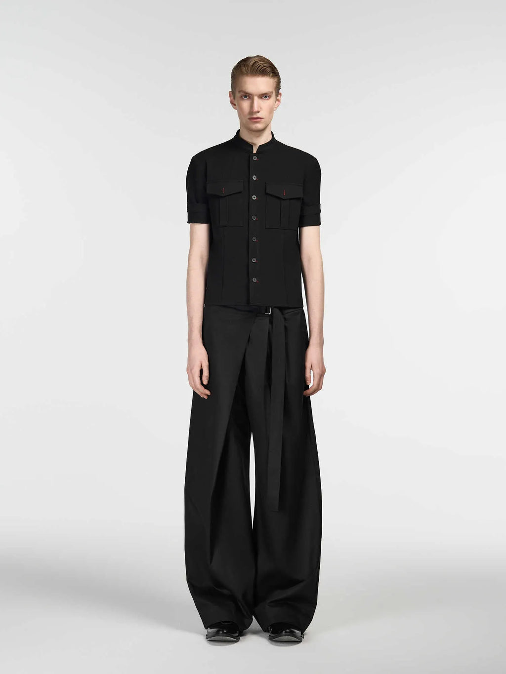 Black straight-leg trousers with adjustable waistband and single pleat detail