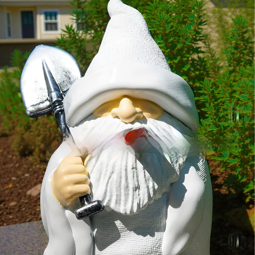 A small resin and plastic Smoking Shovel Dwarf ornament for Christmas garden decoration.