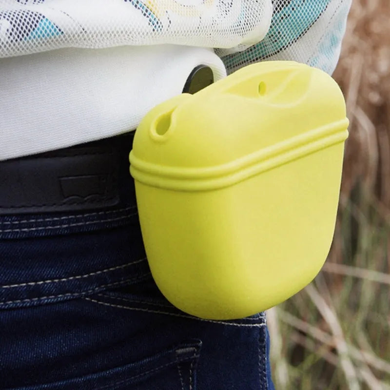 A silicone pet treat waist bag with a clip and magnetic flap closure in various colours.