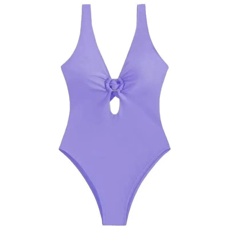A solid colour one-piece swimsuit for women on a hanger, showing the style and available colour options.
