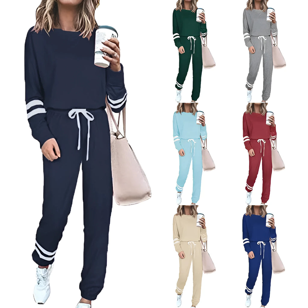 Women's loose-fitting casual suit in solid colour, showing long sleeve top and trousers in cotton blend fabric.
