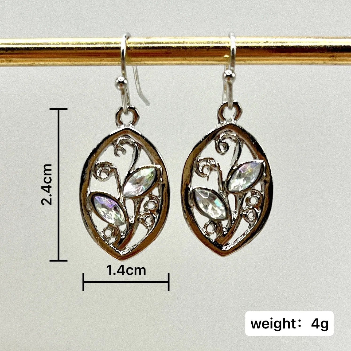 Women's silver leaf-shaped drop earrings with embedded colourful moonstone gemstones