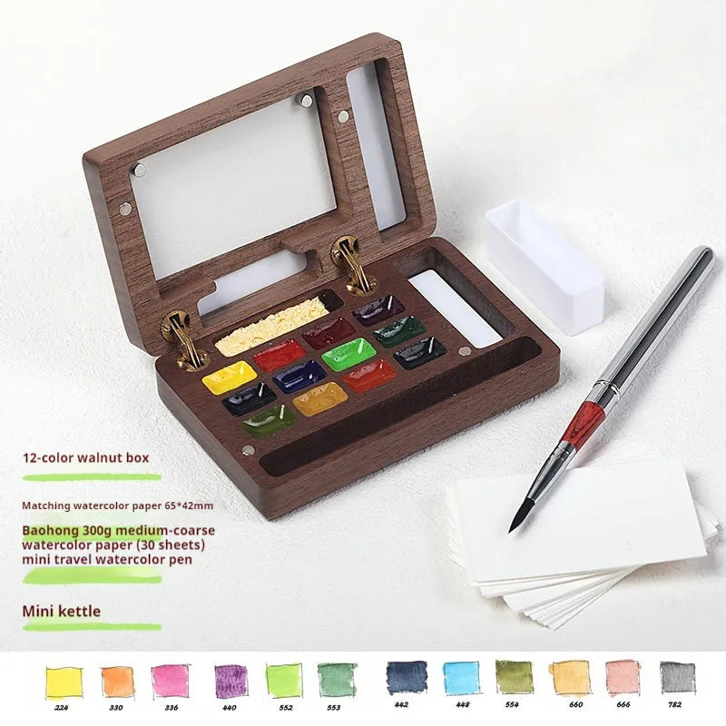 Mini walnut wooden box open to show watercolour pigment pans from Holbein, Schminke, Picasso, or Moonlight Treasure Box sets.