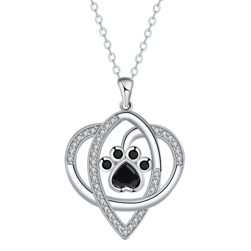 Women's copper necklace with dog and cat paw print pendant on cross chain.