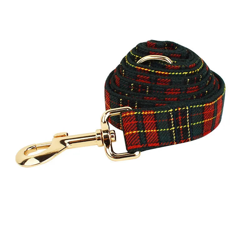 Christmas plaid green dog collar set with leash bow and vest on a festive background