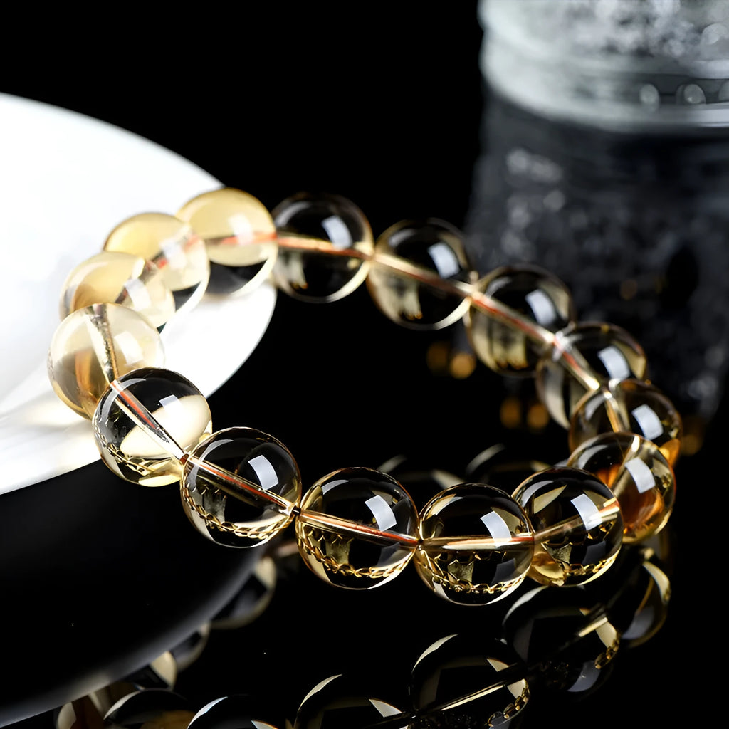 Natural citrine scattered beads ball bracelet showing polished stones and original design on wrist.