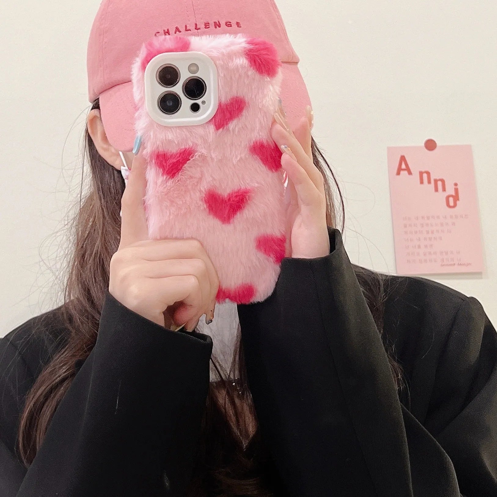 Pink silicone iPhone case with a cartoon design on the back cover.