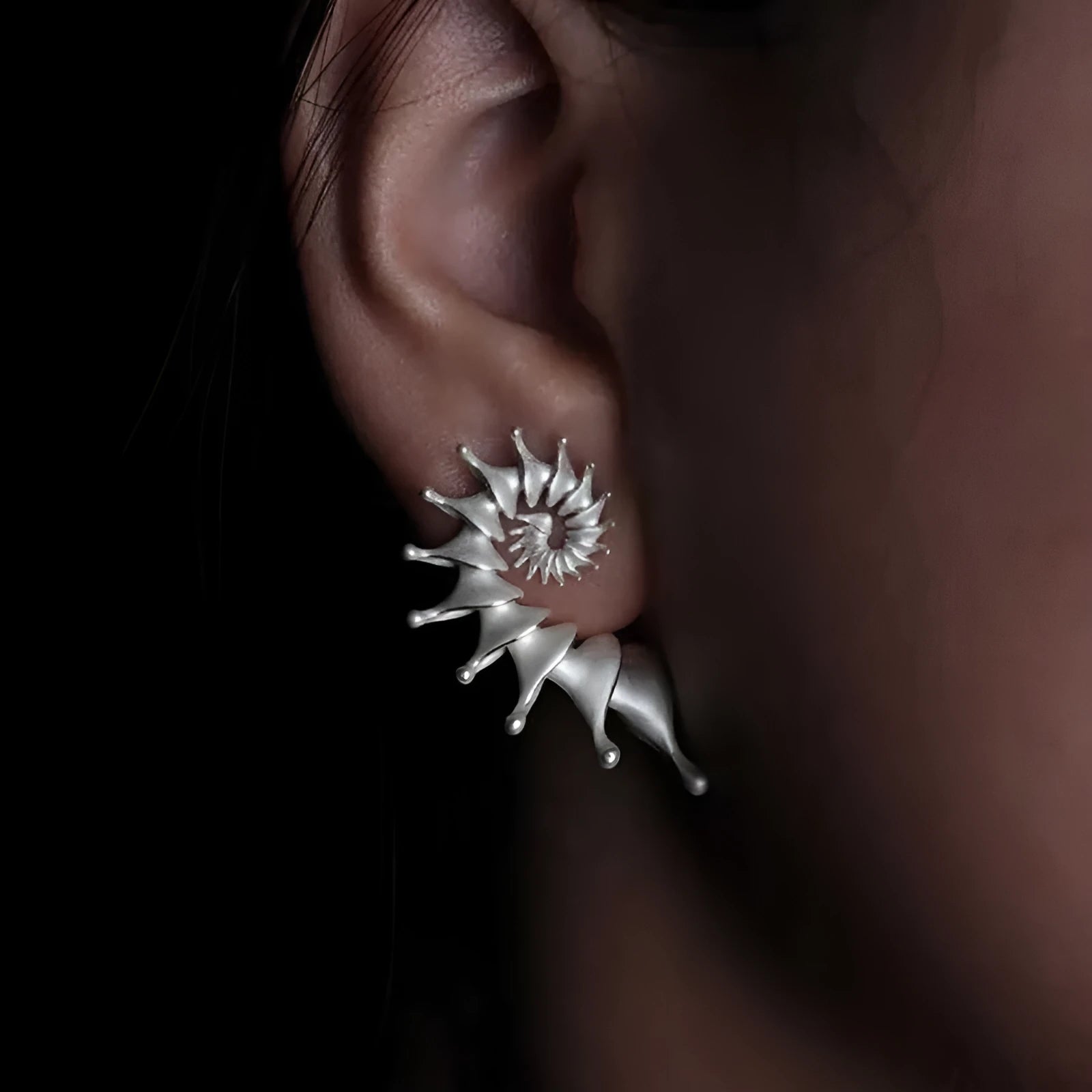 Three-dimensional matte finish conch shell stud earrings with irregular geometric design
