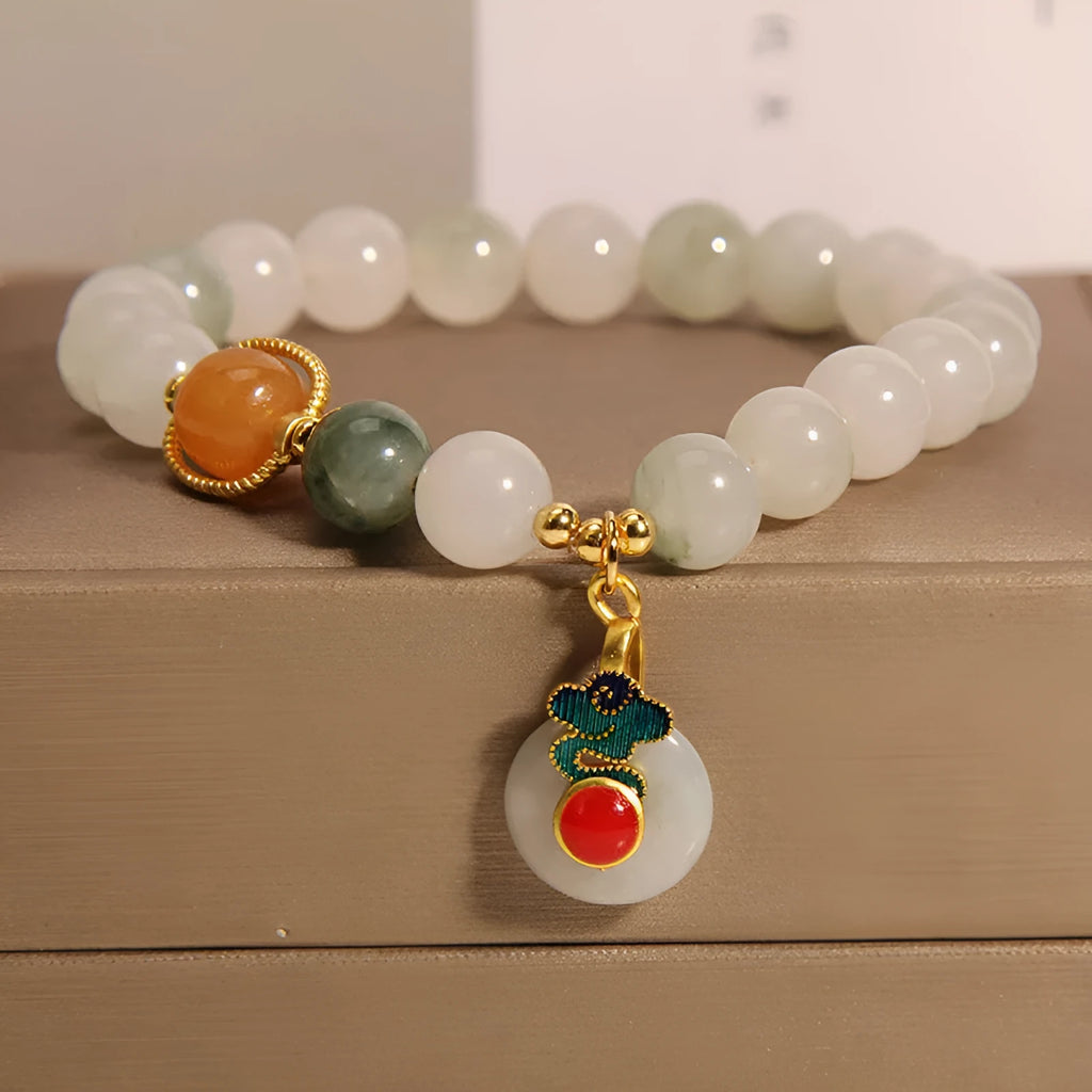 Women's ice jade crystal bracelet with Xiangyun peace buckle and pearl details.