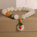 Women's ice jade crystal bracelet with Xiangyun peace buckle and pearl details.