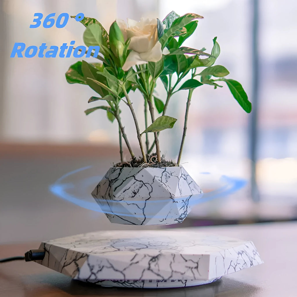 Marbled colour levitating plant pot floating above base with magnetic technology