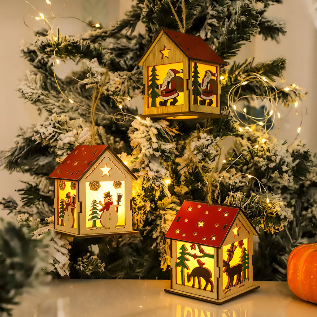Decorative festive luminous wooden pendant with battery, showing snowman shape on a Christmas tree branch