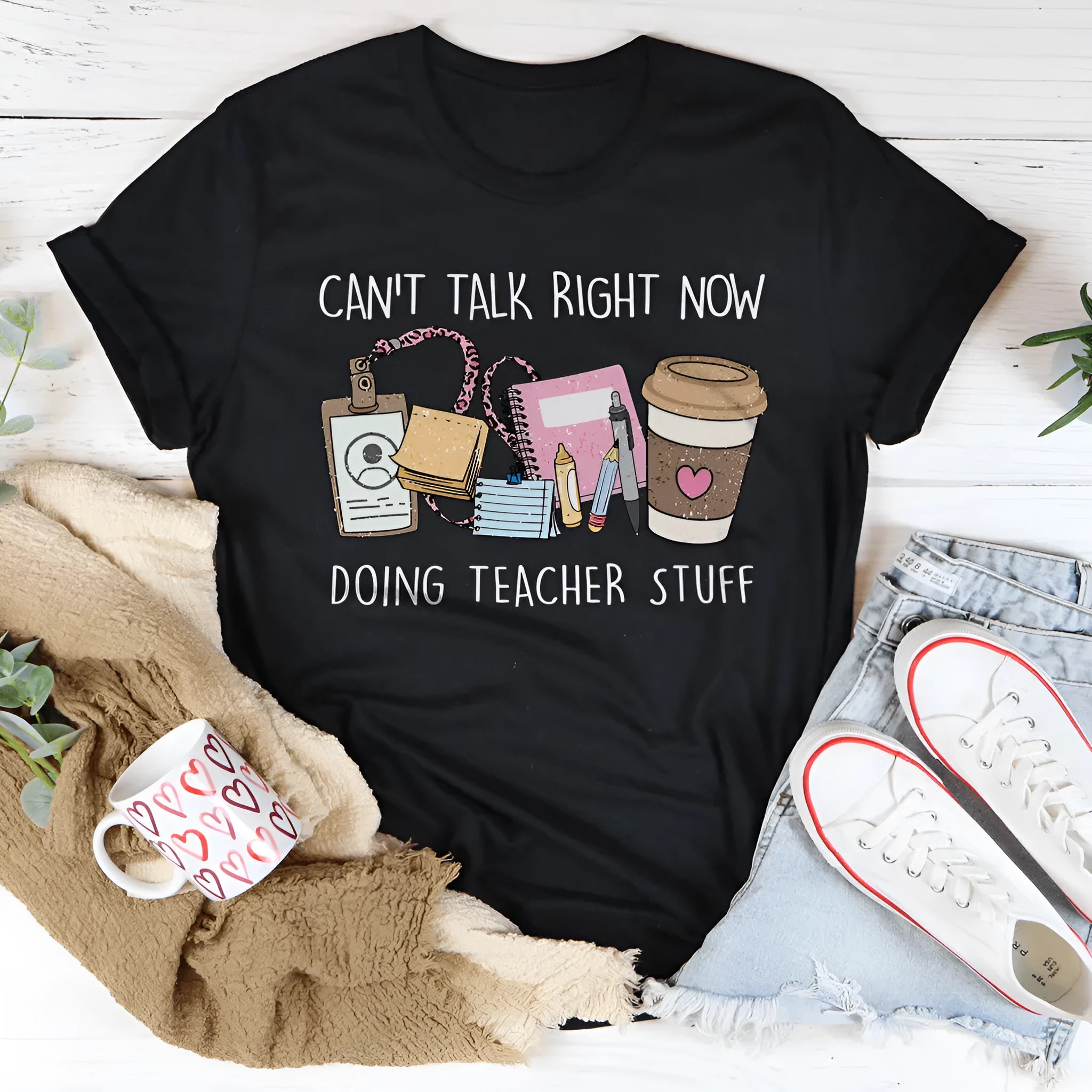 Plain black loose-fit cotton T-shirt with short sleeves and a round neck.