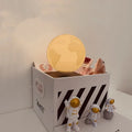 Maglev floating planet night light with three astronaut figurines and USB cable