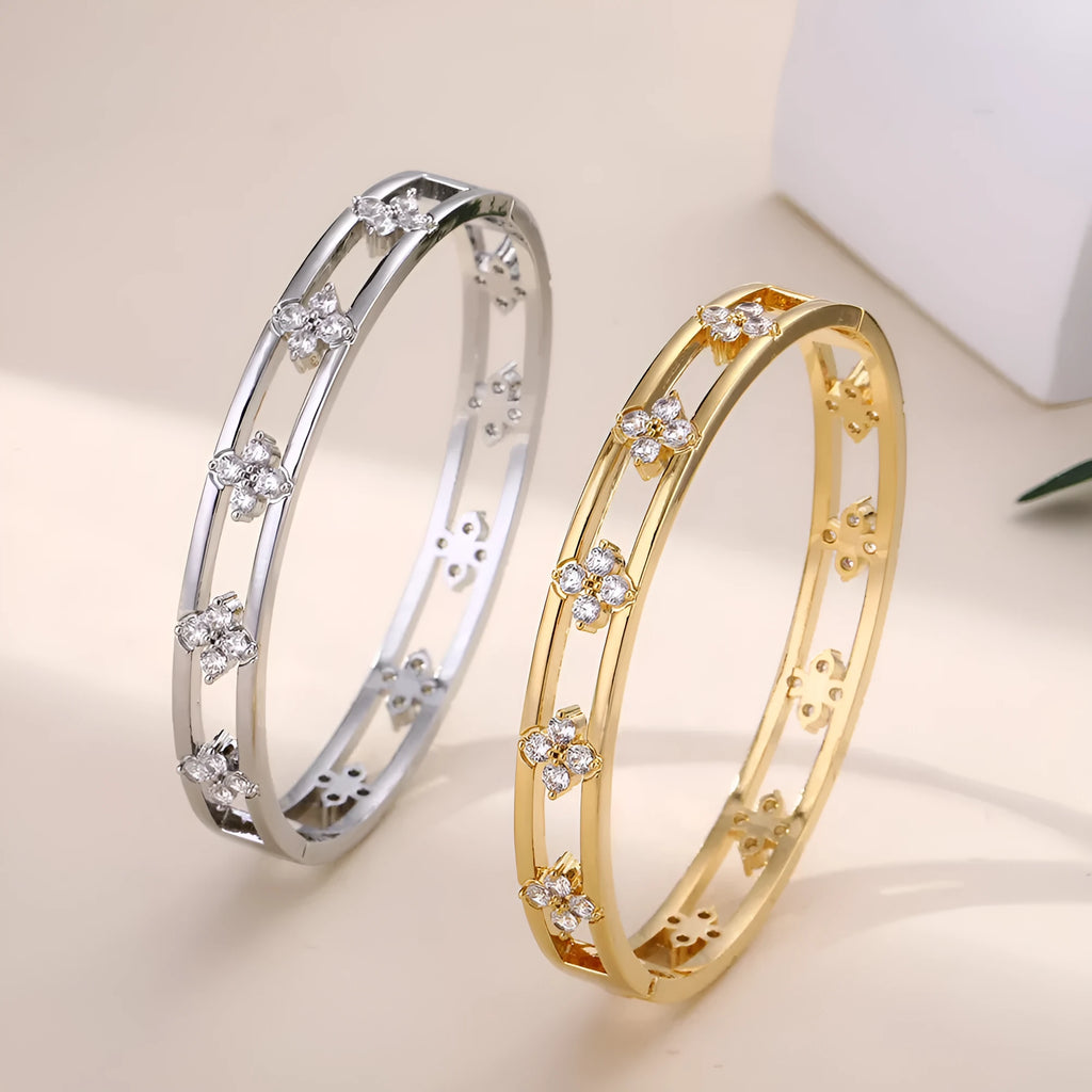 Gold and silver hollow women's bracelets with four-leaf clover charm and zircon stones.