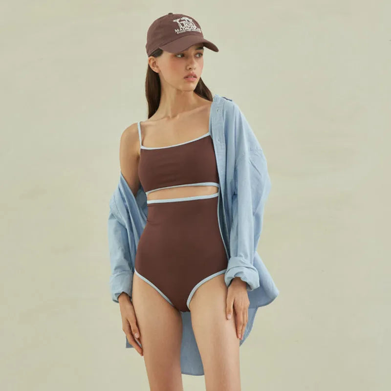 Brown nylon triangle one-piece swimsuit for women on a hanger