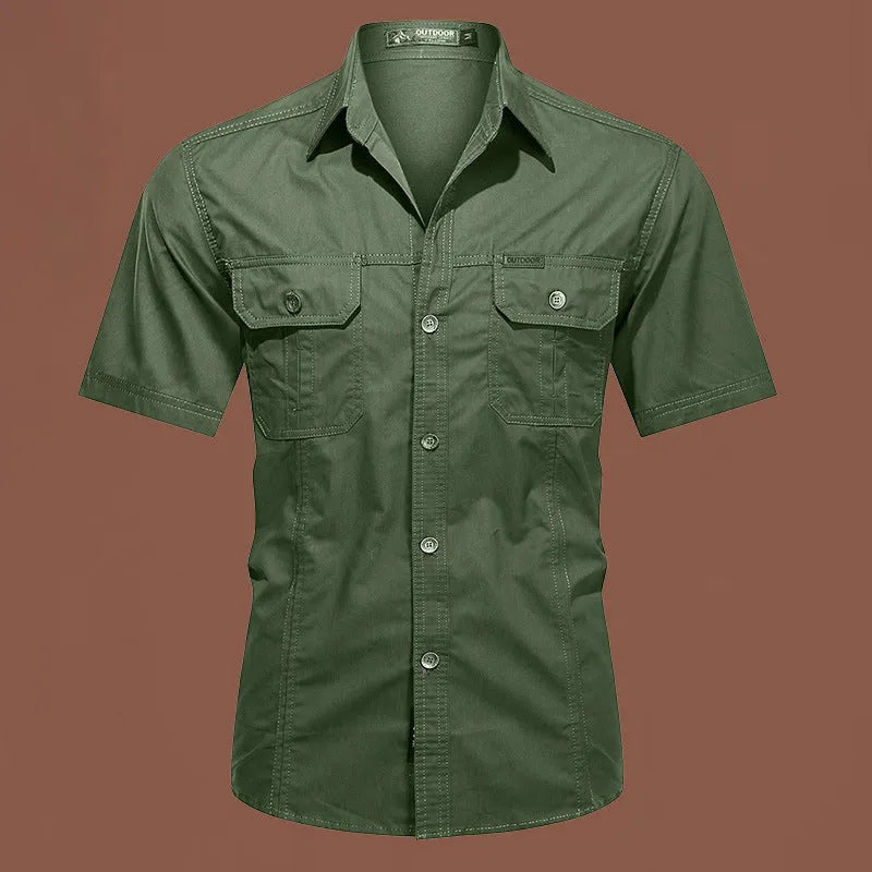 Men's loose fit cotton work shirt in army green with short sleeves and button front.