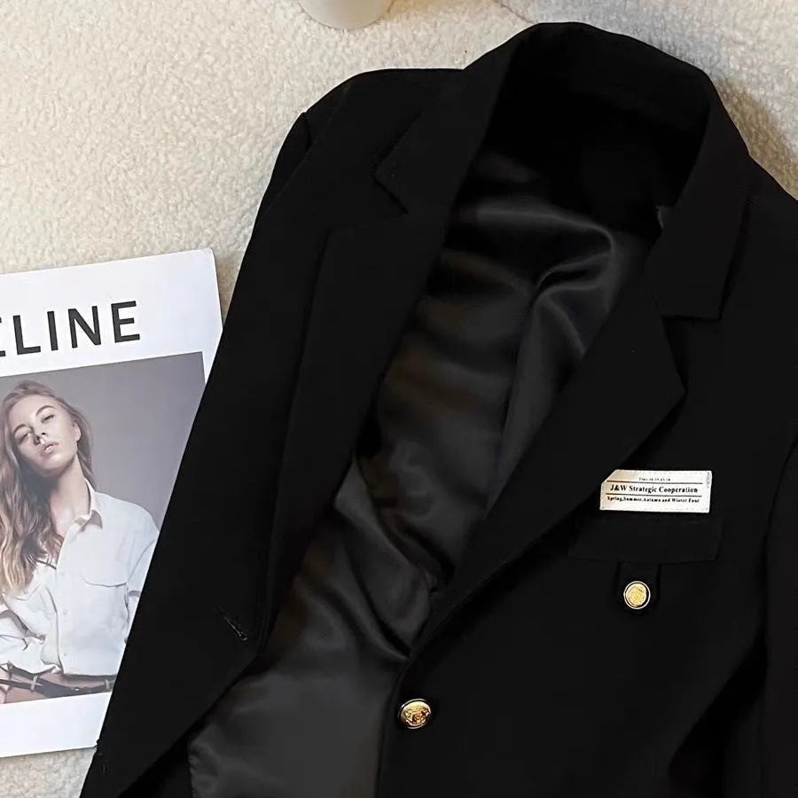 Black women's loose-fit short suit coat with long sleeves and pockets