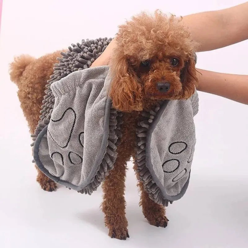 Blue quick-dry pet bath towel shown draped, sized 62 cm by 23 cm for drying dogs and cats.