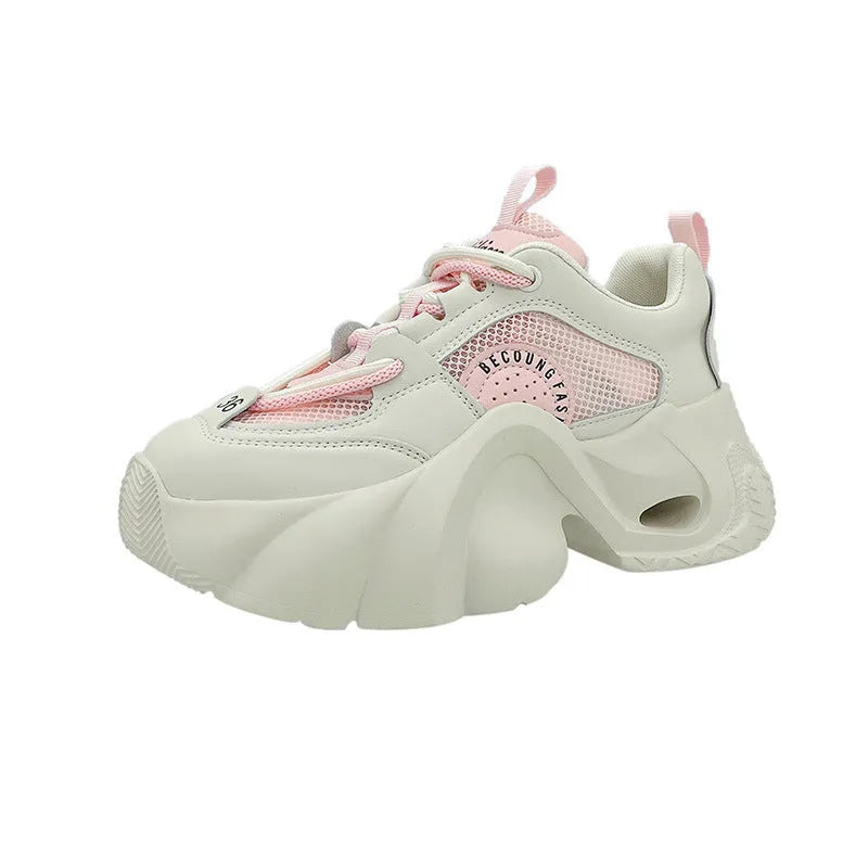 Women's casual sneakers in beige with cross straps, thick sole, and mesh lining.