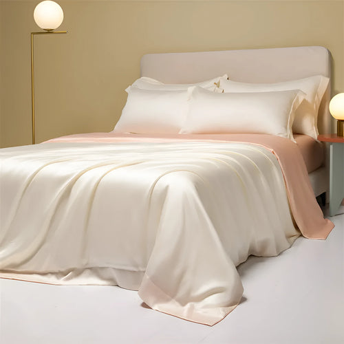 200 thread count Lenzing Tencel quilt cover and sheet set in Aurora Blue, laid on a bed.