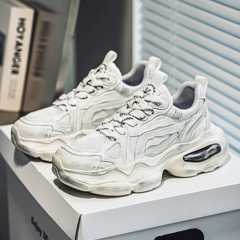 Men's low-top mesh sneakers in grey with a platform sole and lace-up front, on a white background.