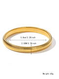 Women's gold titanium steel bracelet with exaggerated vertical stripe ring elastic pattern, showing width options.