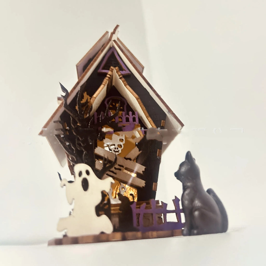 Wooden glowing haunted house Halloween table decoration with candlestick holder, 14cm wide.