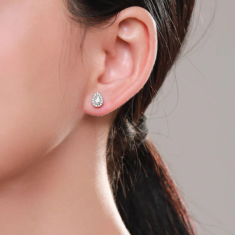 Women's silver water drop ear studs with diamond finish and 925 sterling silver construction