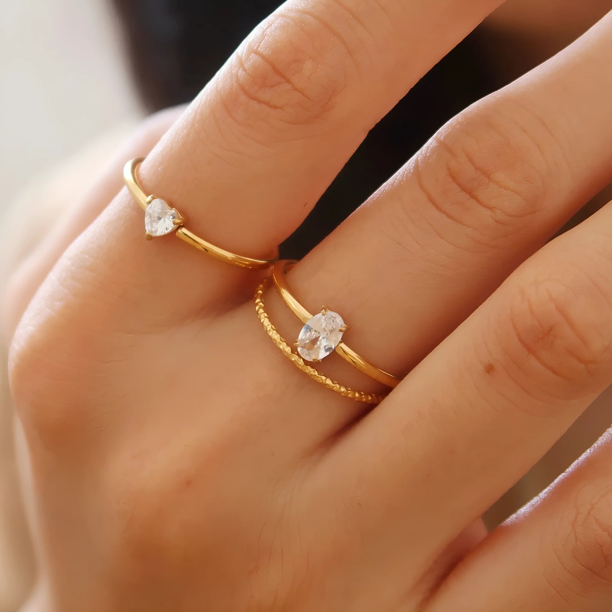 Women's golden heart-shaped stainless steel ring with love design in multiple sizes