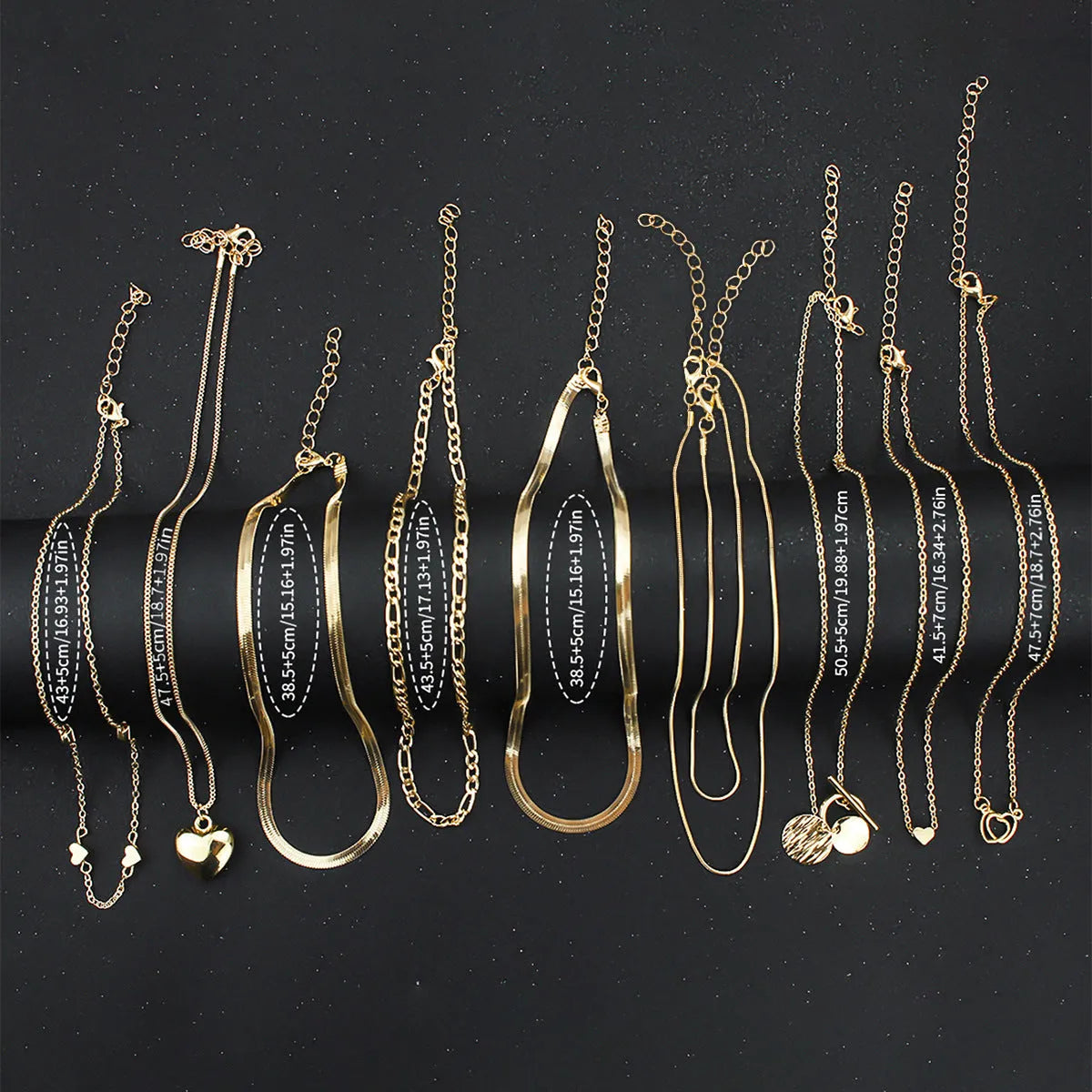 Gold electroplated women's necklace jewellery set with snake chain construction and alloy pendants
