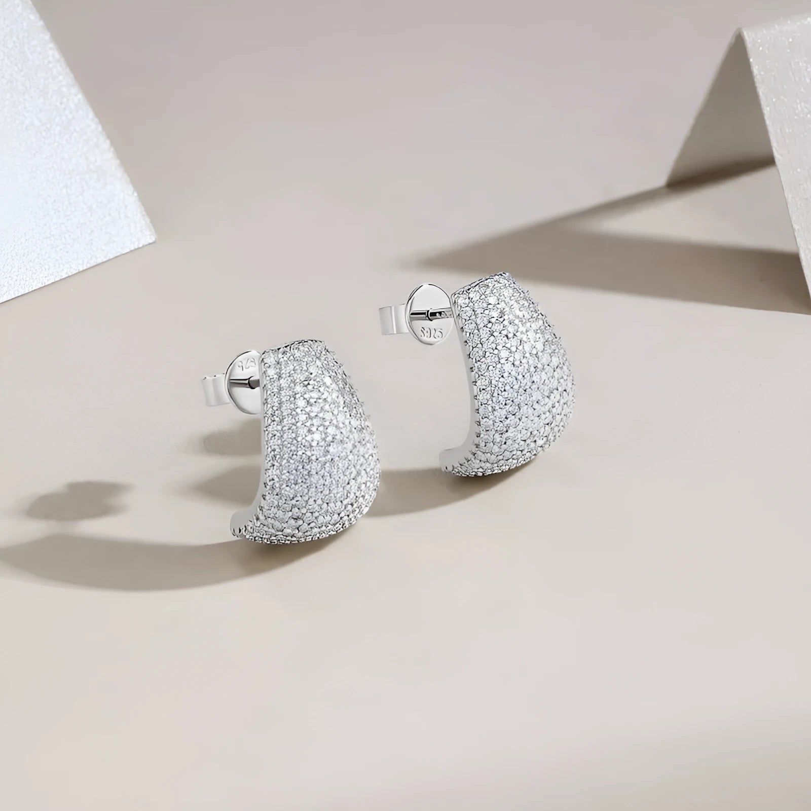 Geometric S925 sterling silver stud earrings with a white moissanite centre for women.
