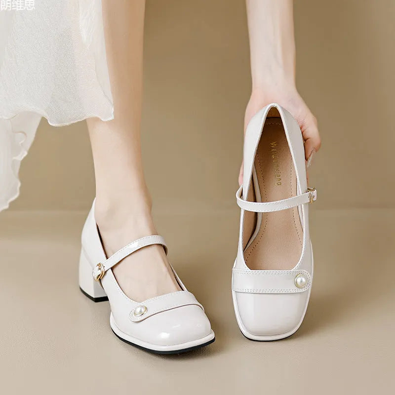 Women's patent leather ankle boots with chunky heels and square toe in apricot colour with buckle fastening