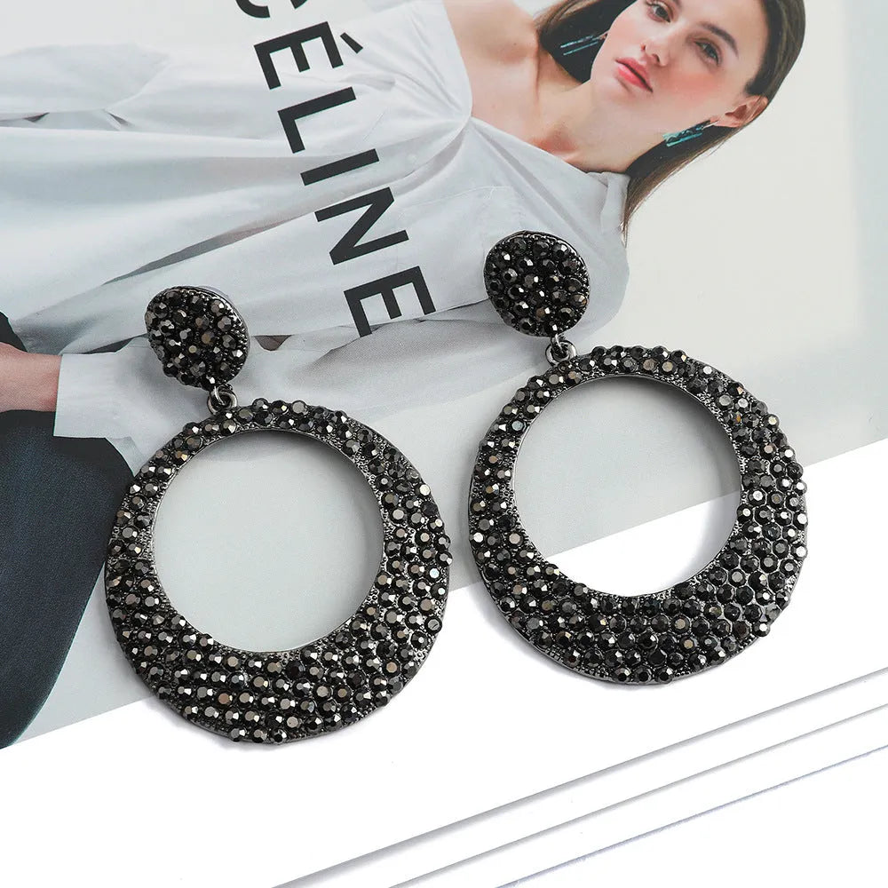 Colourful round pendant earrings with metal diamond detailing and cartoon style