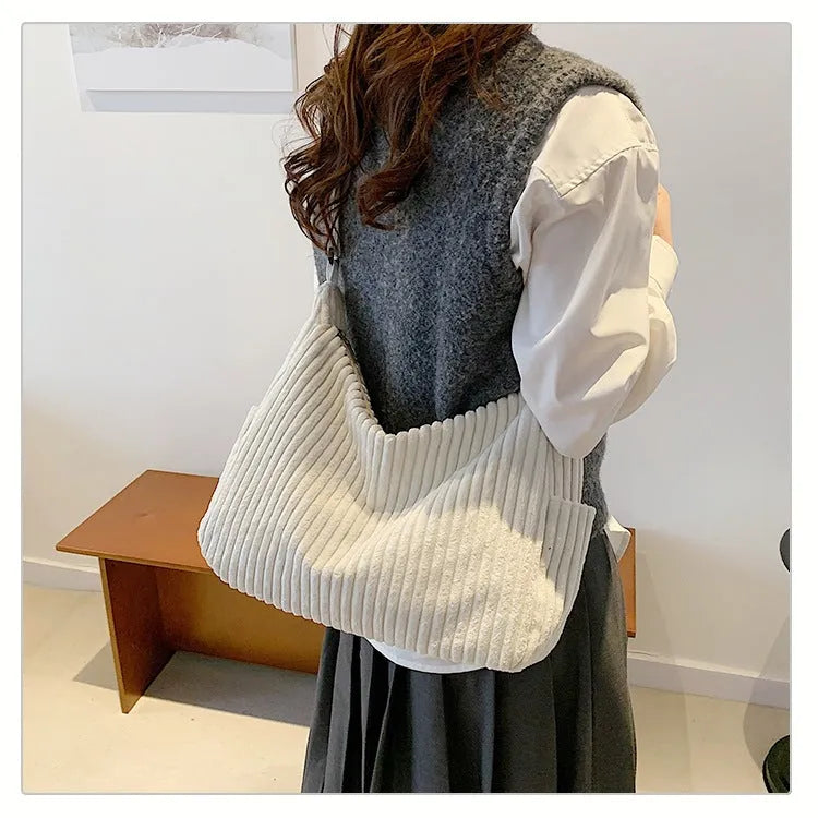 Corduroy crossbody bag in black, white or grey with single strap and sandwich pocket