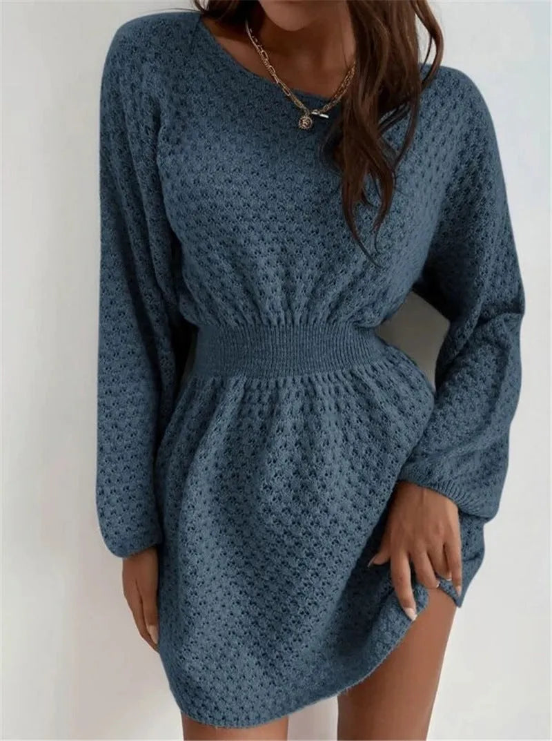 Blue women's knitted dress with hand-crocheted flowers, fitted waist, and round neckline