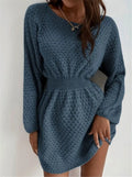 Blue women's knitted dress with hand-crocheted flowers, fitted waist, and round neckline