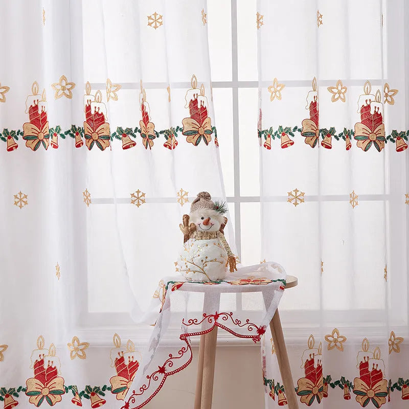 A pair of American-style Christmas curtains with white embroidered snowflakes on a red background.