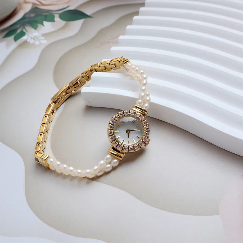 Women's light gold watch with freshwater pearl bracelet and round 18mm dial