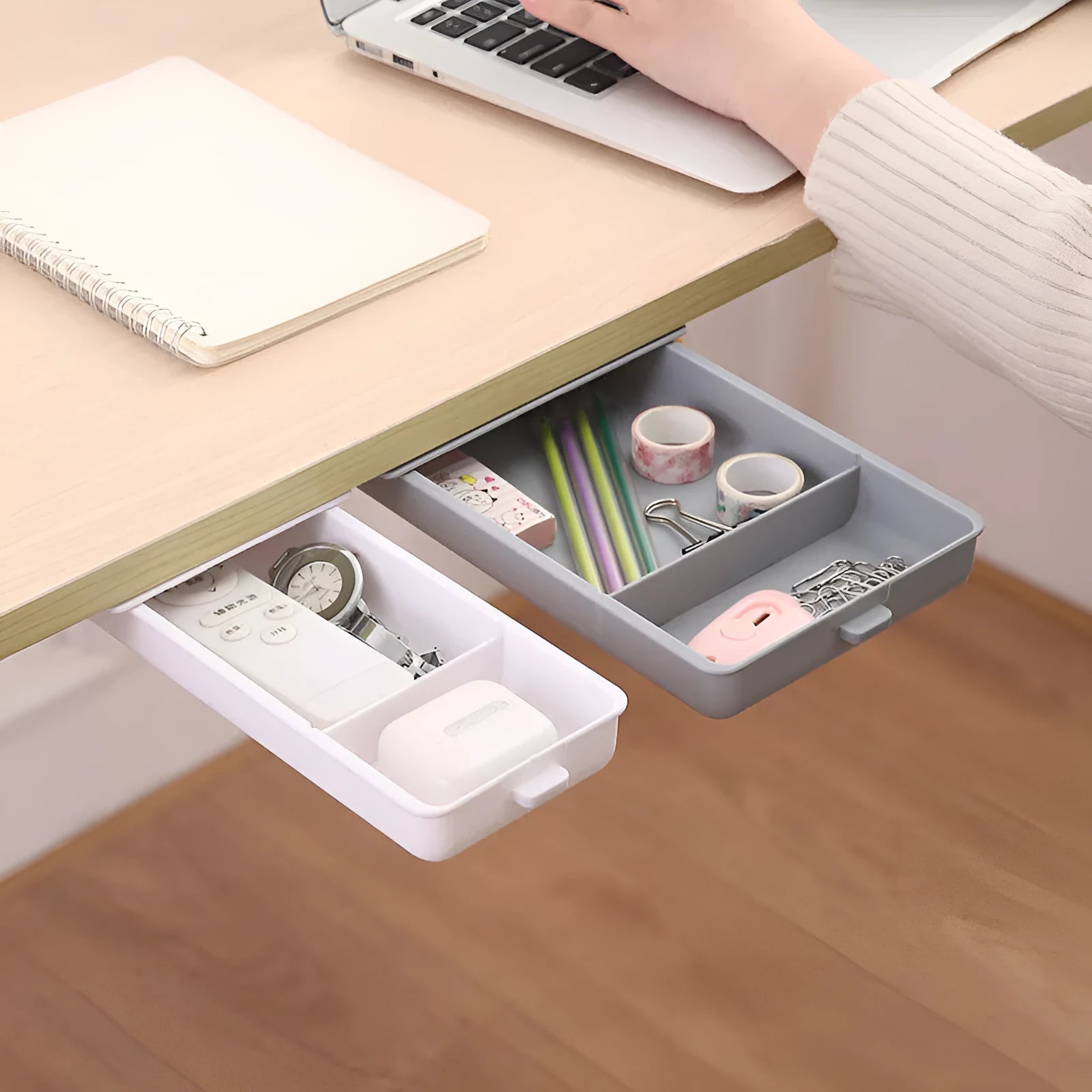 Plastic under-table storage drawer with lid open, showing internal grid, in choice of colours.