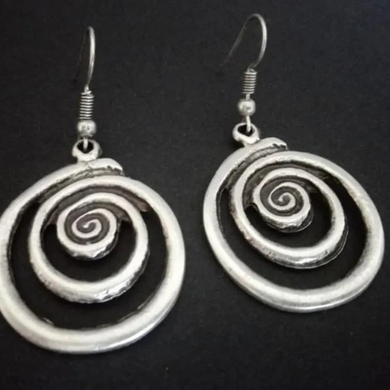 Silver alloy geometric spiral distressed drop earrings with national style, shown front-on.