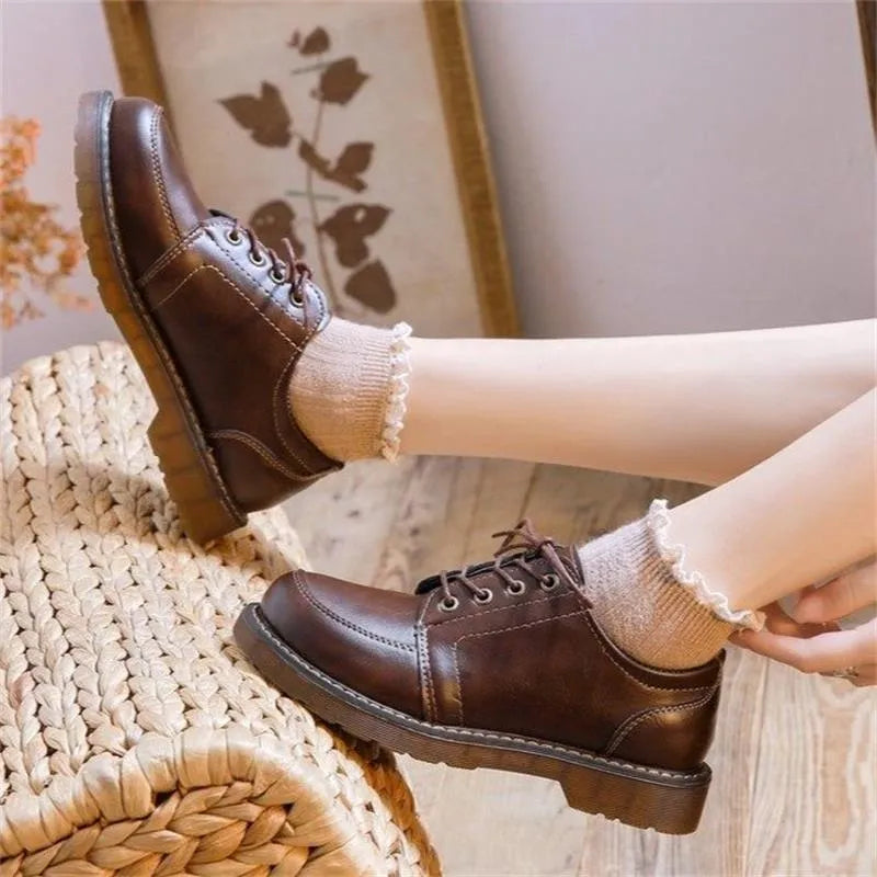 Women's preppy style Mary Jane pumps with round toe and front lace-up in black and brown