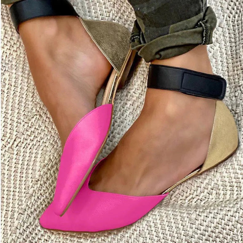 Women's hollowed velcro sandals in PU material showing adjustable straps and flat heel design