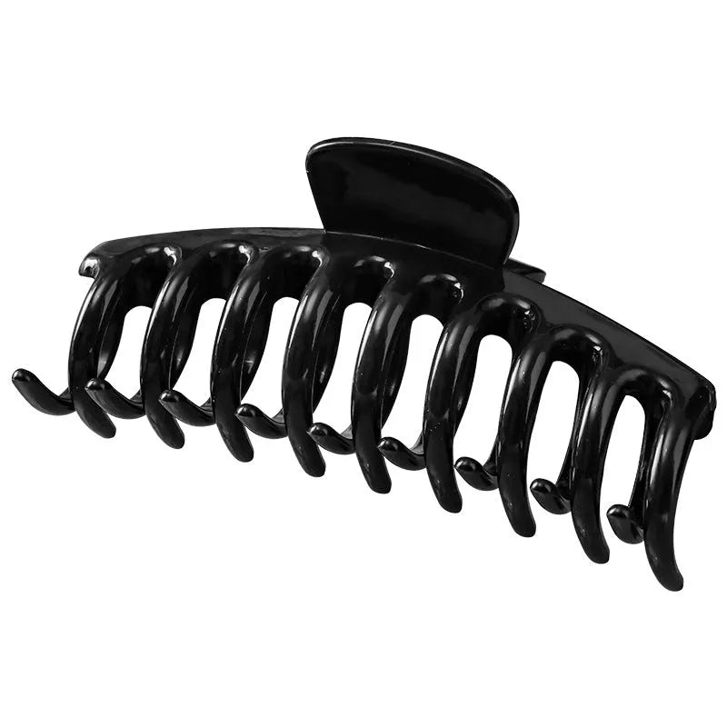 Soft rubber large back head barrette with keel grip, 11cm, in black, showing anti-collision design