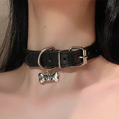 Black adjustable dog collar showing LD leather, bone, and cat paw design options